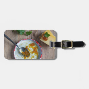 Onion pineapple chutney on rustic wood luggage tag