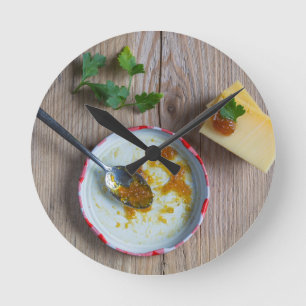 Onion pineapple chutney on rustic wood round clock