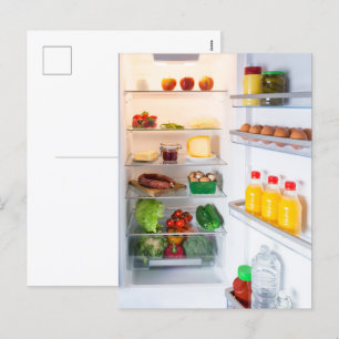 Open fridge filled with food holiday postcard