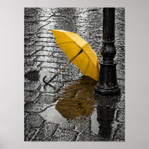 Open Yellow Umbrella on Rainy Cobblestone Street