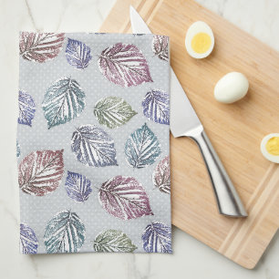 Openwork leaves on a light grey background tea towel