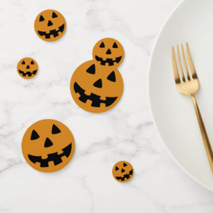 orange and black jack o' lantern face confetti