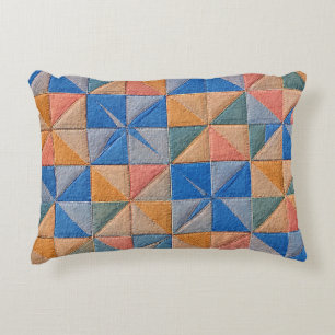orange and blue quilt decorative cushion