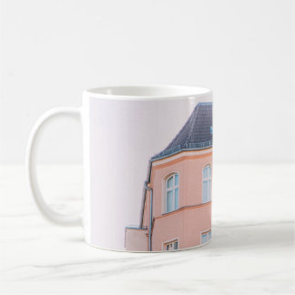ORANGE AND WHITE CONCRETE BUILDING COFFEE MUG