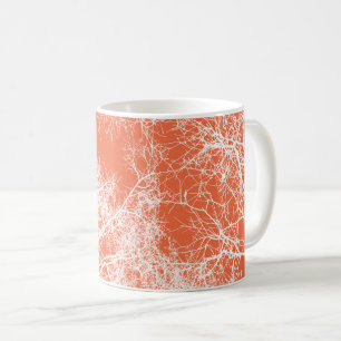 Orange and white silhouetted trees coffee mug
