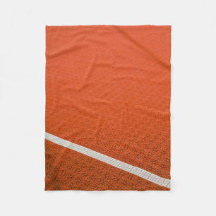 Orange and white textile fleece blanket