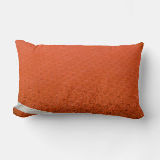 Orange and white textile lumbar cushion