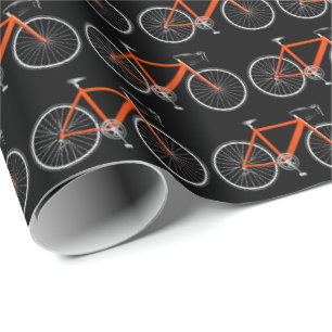 orange bicycle on black wrapping paper
