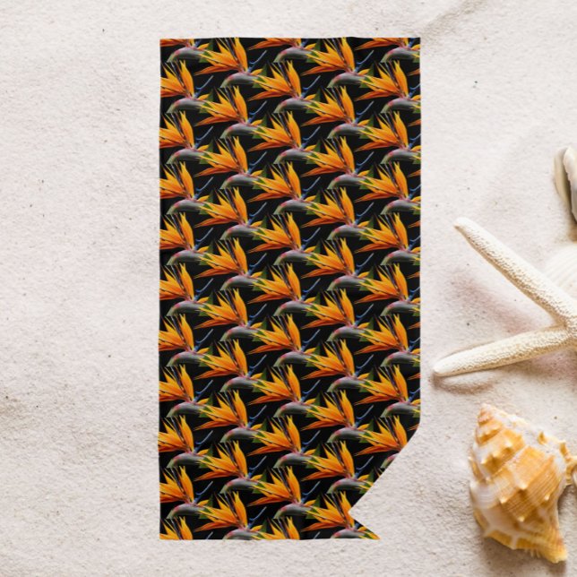 Orange Bird of Paradise Plant Pattern on Black Beach Towel (In Situ)