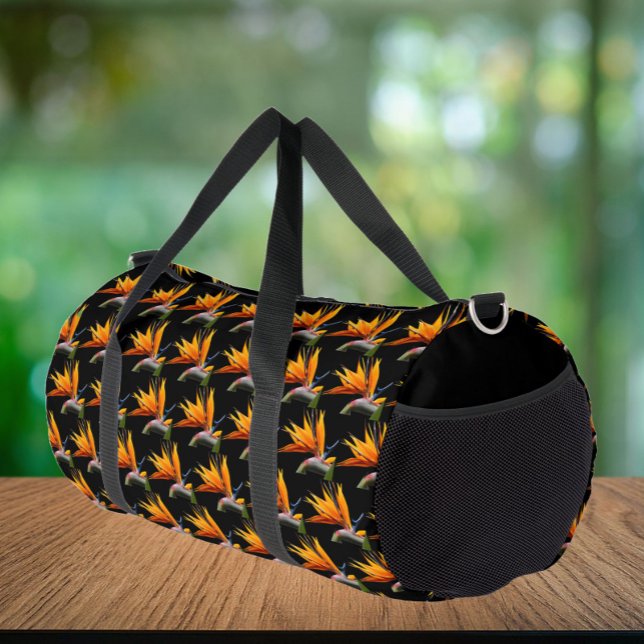 Orange Bird of Paradise Plant Pattern on Black Duffle Bag (In Situ)