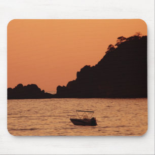 orange boat at sea mousepad