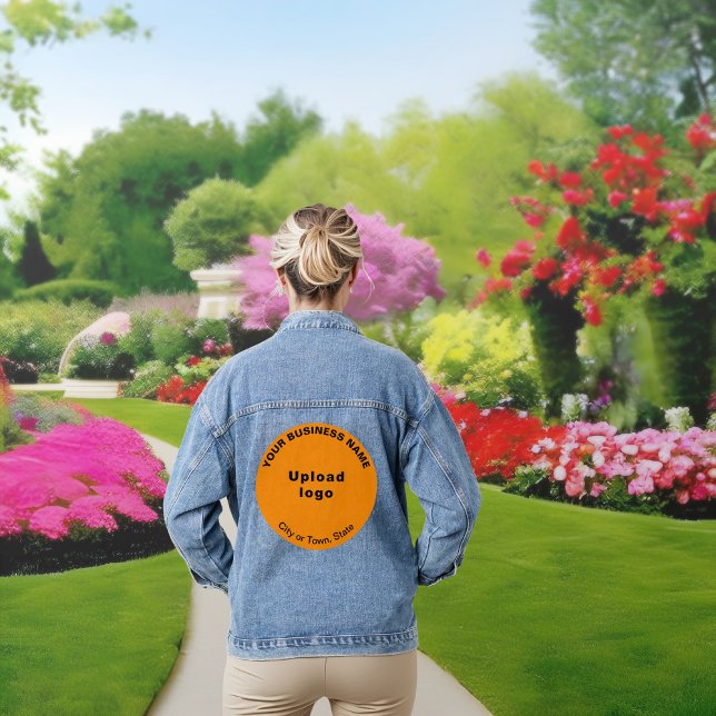 Orange Colour Round Business Brand on Women's Denim Jacket (Orange color round business brand on women's denim jacket.)
