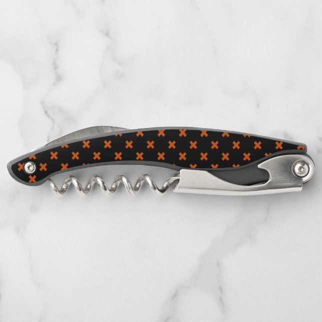 Orange cross stitches on black corkscrew (Back)