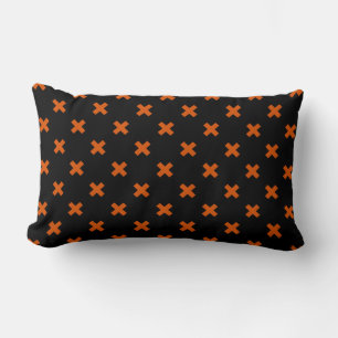 Orange cross stitches on black lumbar cushion