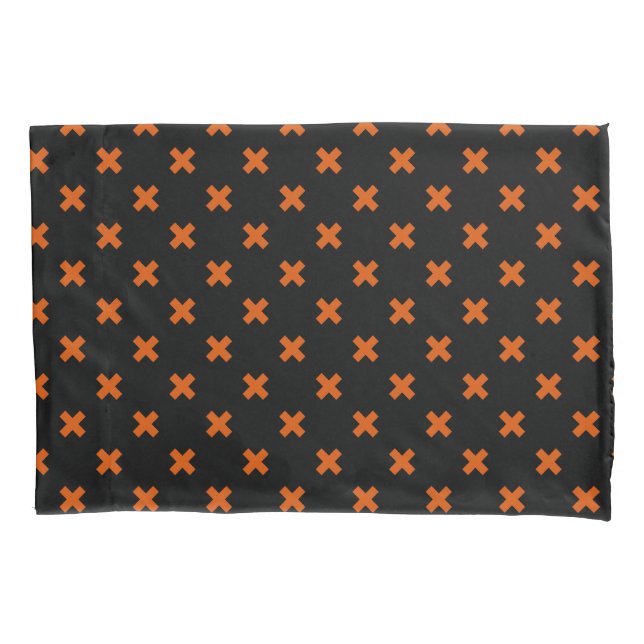 Orange cross stitches on black pillowcase (Front)