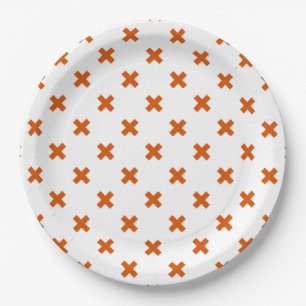 Orange cross stitches on white paper plate