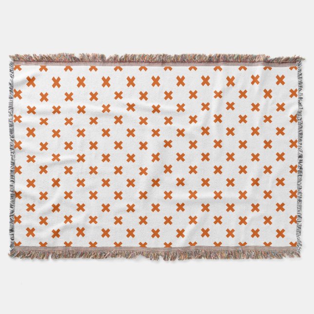 Orange cross stitches on white throw blanket (Front)