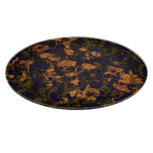 Orange flower against leaf camouflage pattern cutting board