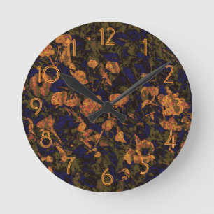 Orange flower against leaf camouflage pattern round clock