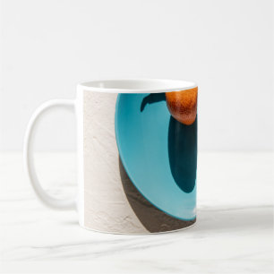 Orange fruit on plate coffee mug