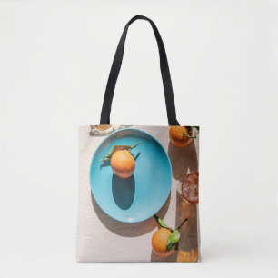 Orange fruit on plate tote bag