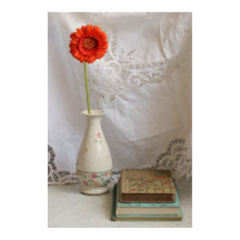 Orange gerbera and books
