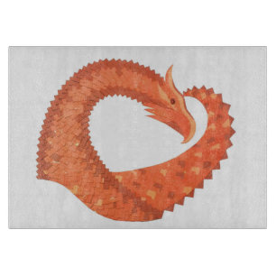 Orange heart dragon on white cutting board