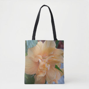 Orange hibiscus flower on a tote bag