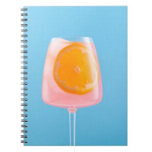 Orange juice in clear drinking glass notebook
