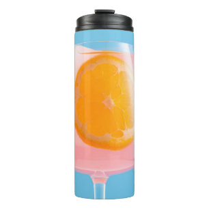 Orange juice in clear drinking glass thermal tumbler