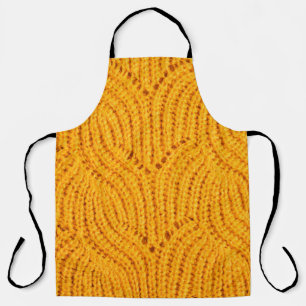 Orange knitted sweater, textured background. apron