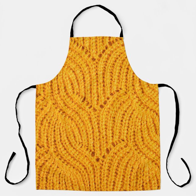 Orange knitted sweater, textured background. apron (Front)