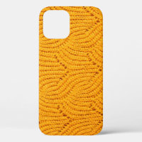 Orange knitted sweater, textured background.
