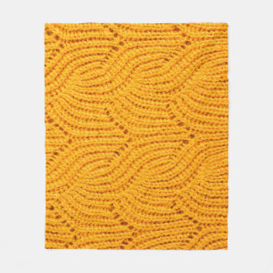 Orange knitted sweater, textured background. fleece blanket