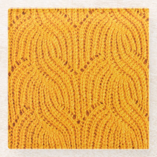 Orange knitted sweater, textured background. glass coaster (Front)