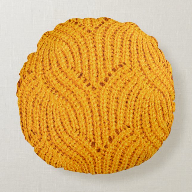 Orange knitted sweater, textured background. round cushion (Front)