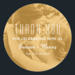 Orange Overlay Photo Wedding Thank You Classic Round Sticker<br><div class="desc">Elegant round wedding thank you sticker featuring your couple photo under a warm orange transparent overlay with modern typography. Personalized with your names and wedding date, this photo sticker is perfect for sealing envelopes, favor boxes, or gift bags. A stylish and heartfelt way to thank guests while adding a cohesive...</div>