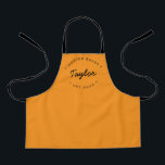 Orange Personalised Name Year Master Baker Apron<br><div class="desc">Let's get baking. Customise the Name and established year as you need on this kid's apron. This personalised apron on orange with white type. Stylish typography style treatment. Encourage the Master baker in your life with a special gift. Perfect for baking those holiday Christmas cookies, everyday desserts, treats and baked...</div>