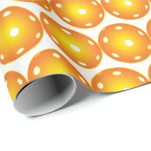 Orange pickleballs all over wrapping paper