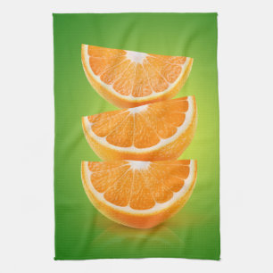 Orange pieces on green tea towel