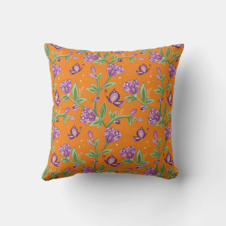 Orange pillow with floral purple butterflies