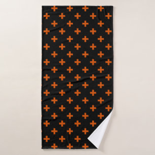 Orange polka crosses on black bath towel