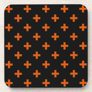 Orange polka crosses on black coaster