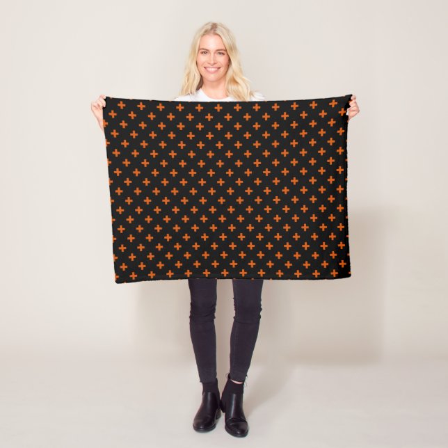 Orange polka crosses on black fleece blanket (In Situ)