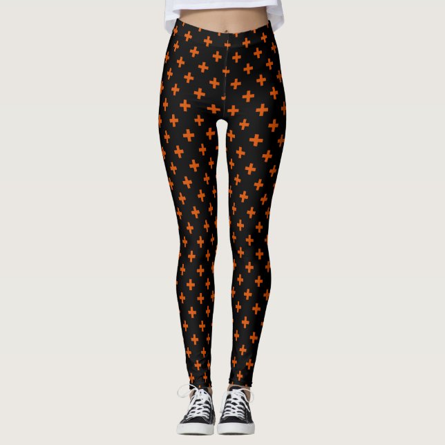 Orange polka crosses on black leggings (Front)