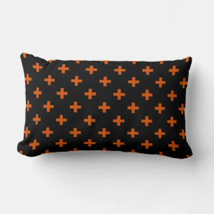 Orange polka crosses on black lumbar cushion