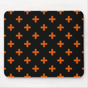 Orange polka crosses on black mouse pad