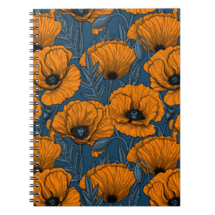 Orange poppies on dark blue notebook