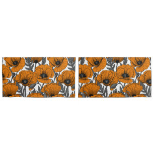 Orange poppies on white pillowcase