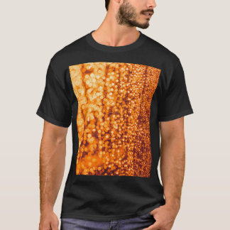 Orange raindrops on glass, abstract background. T-Shirt